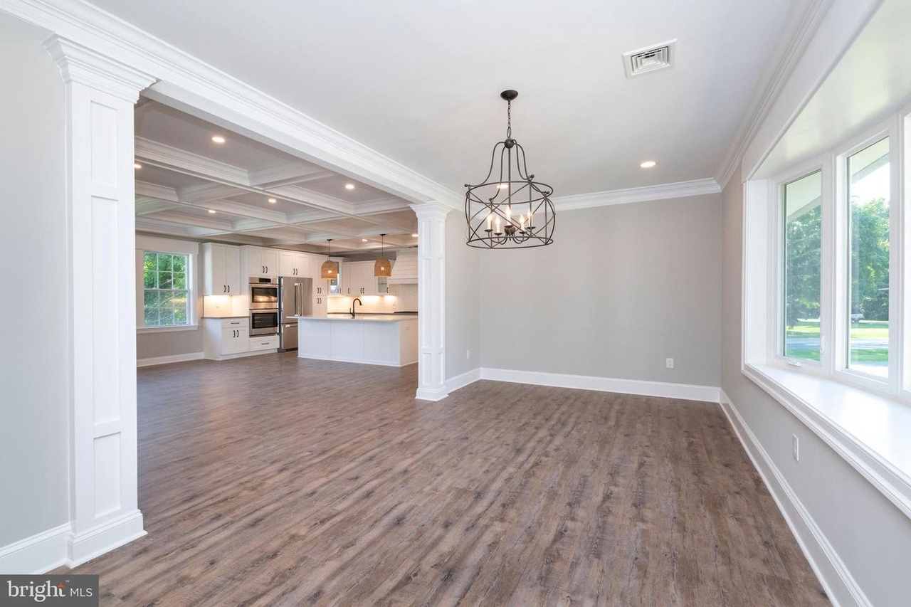 Chapel Ridge — dining room with a chandelier and wide windows