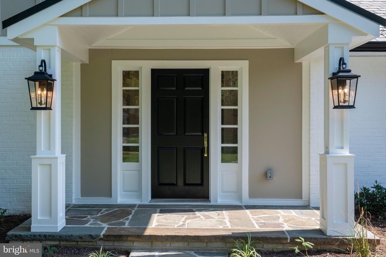 Chapel Ridge — covered front entrance with sidelights and wall lanterns